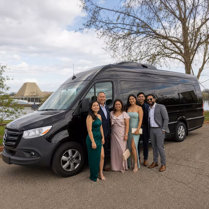 Group beside a Mercedes Sprinter limo from the Sacramento fleet