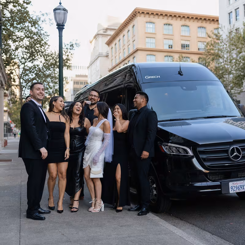 Group boarding a white charter bus for Bachelor & Bachelorette Transportation transportation in Sacramento