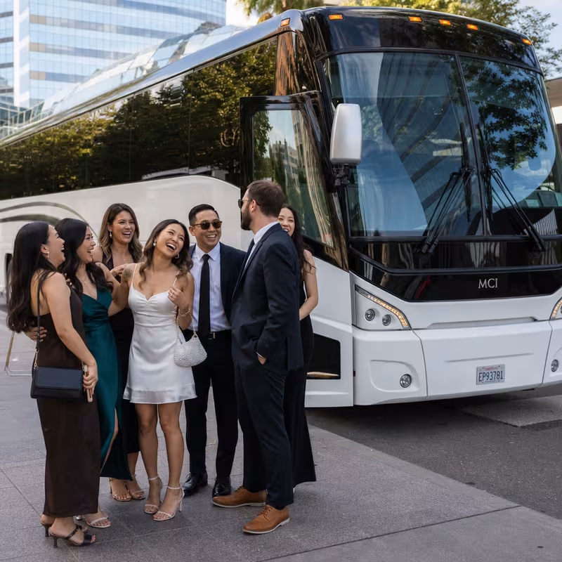 Passengers loading luggage while boarding an Sacramento group shuttle