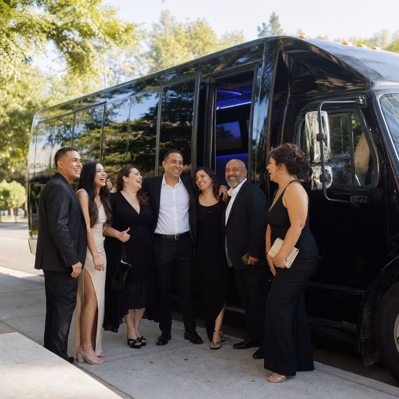 Passengers loading luggage while boarding an Sacramento group shuttle