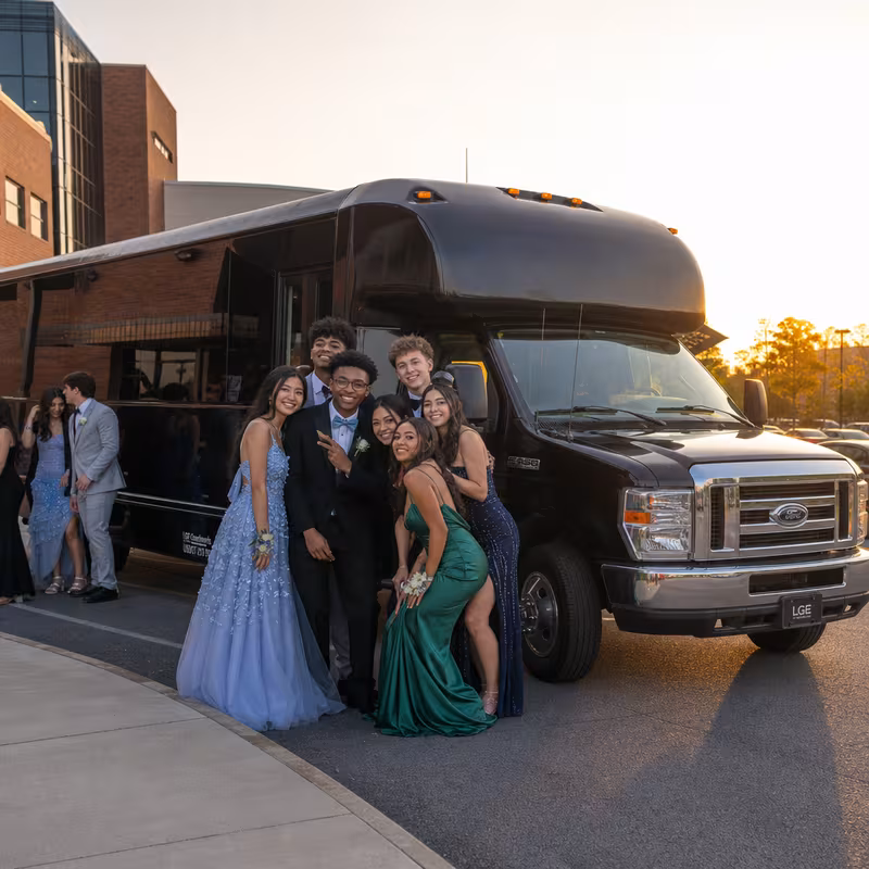 Group boarding a white charter bus for Prom & Homecoming Transportation transportation in Sacramento
