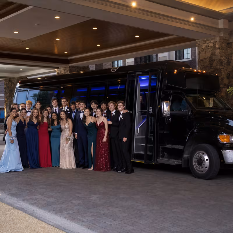 Party bus interior with wraparound leather seating and LED lighting in Sacramento