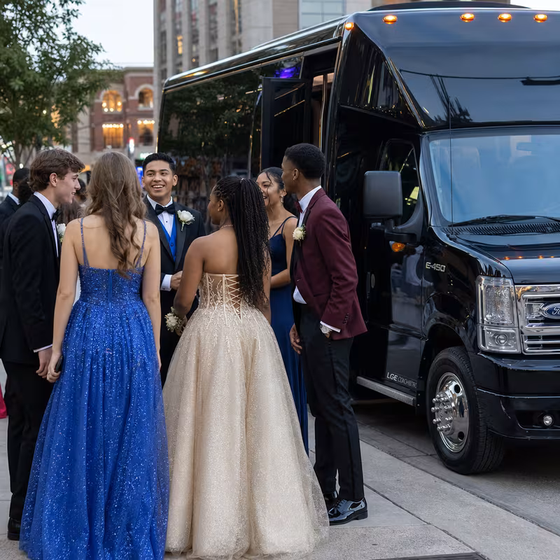 Passengers loading luggage while boarding an Sacramento group shuttle