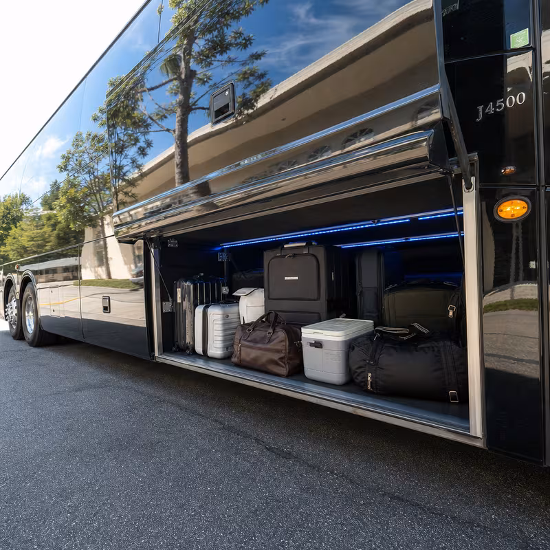 Party bus interior with wraparound leather seating and LED lighting in Sacramento