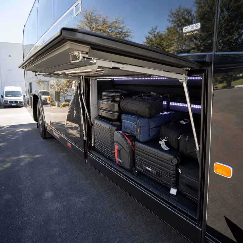 Party bus interior with wraparound leather seating and LED lighting in Sacramento