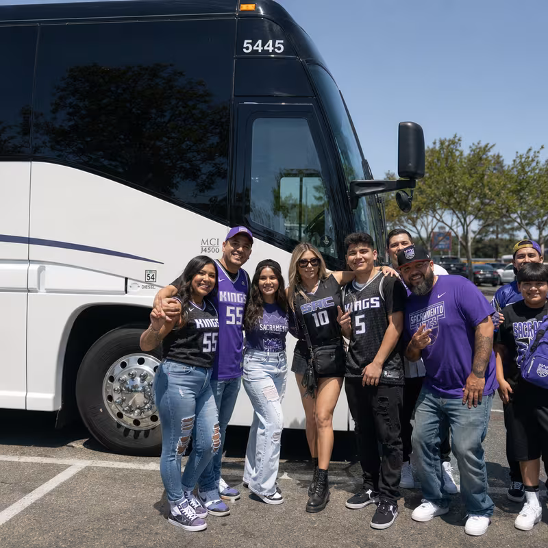 Passengers loading luggage while boarding an Sacramento group shuttle