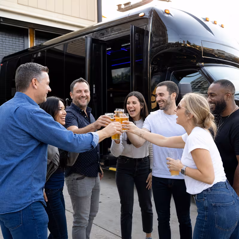 Passengers loading luggage while boarding an Sacramento group shuttle